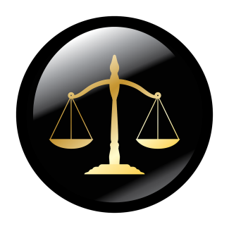 Gold, balanced scales of justice on a round black background